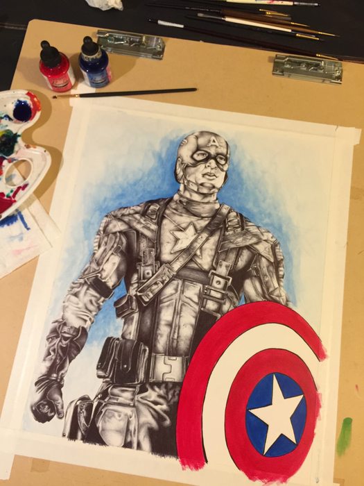 The drawing with a blue wash behind it and the shield painted red, white and blue in ink
